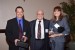 Dr. Nagib Callaos, General Chair, giving Dr. Houman Sadri and Dr. Madelyn Flammia an award "In Appreciation for Delivering a Great Keynote Address at a Plenary Session."